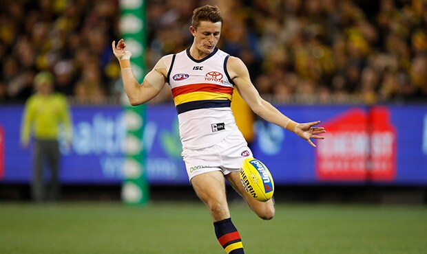 AFL 2018 Round 16 - Richmond v Adelaide MELBOURNE, AUSTRALIA - JULY 06: Matt Crouch of the Crows kicks the ball during the 2018 AFL round 16 match between the Richmond Tigers and the Adelaide Crows at the Melbourne Cricket Ground on July 06, 2018 in Melbourne, Australia. (Photo by Michael Willson/AFL Media)